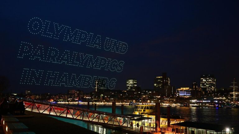 Symbolbild zur deutschen Olympia-Bewerbung mit olympischen Ringen und der Skyline einer deutschen Großstadt