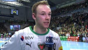 Mathias Gidsel im Trikot der Füchse Berlin in Aktion gegen den SC Magdeburg