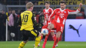 Collage von Leon Goretzka und Julian Brandt in ihren jeweiligen Vereinstrikots auf dem Spielfeld