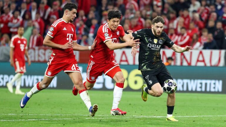 Minjae Kim im Trikot des FC Bayern München blickt konzentriert auf das Spielfeld