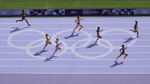 Die olympischen Ringe als Symbol für den historischen IOC-Beschluss zur Bezahlung aller Athleten bei den Spielen.