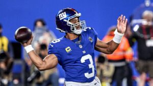 Quarterback Russell Wilson im Trikot der Seattle Seahawks auf dem Spielfeld in der NFL