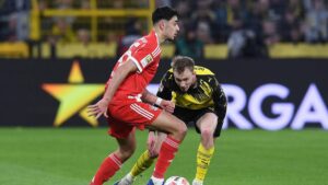 Zweikampf zwischen Spielern des FC Bayern München und Borussia Dortmund